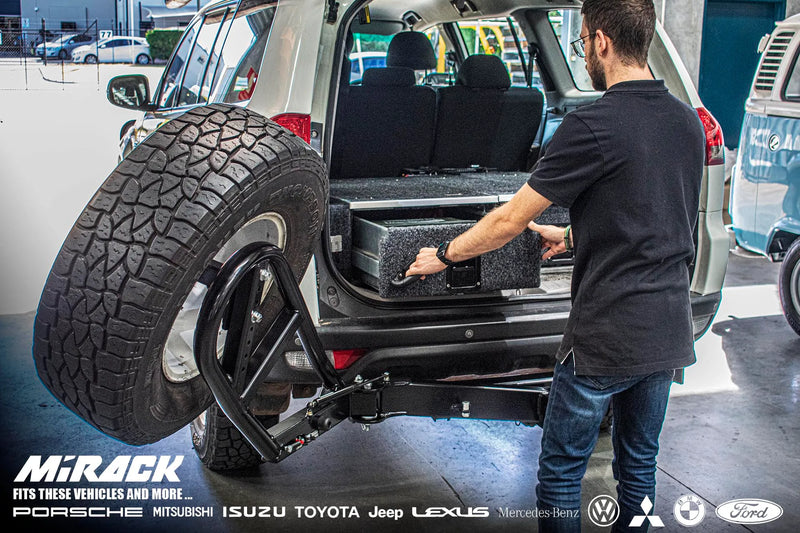 Load image into Gallery viewer, Mitsubishi Challenger Pathfinder equipped with a Mirack spare wheel carrier, showcasing its open design for effortless tyre access.