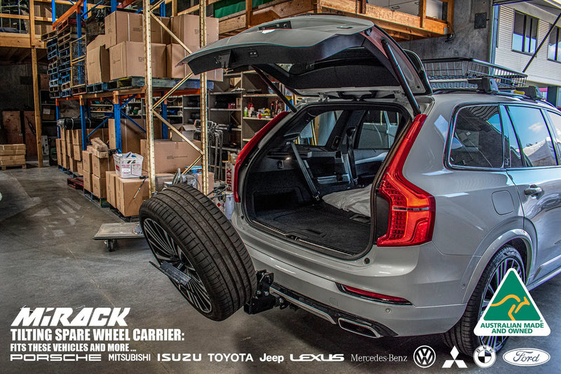 Load image into Gallery viewer, Conquer any terrain with a tilting spare wheel carrier for your Volvo SUV (tow hitch mount).