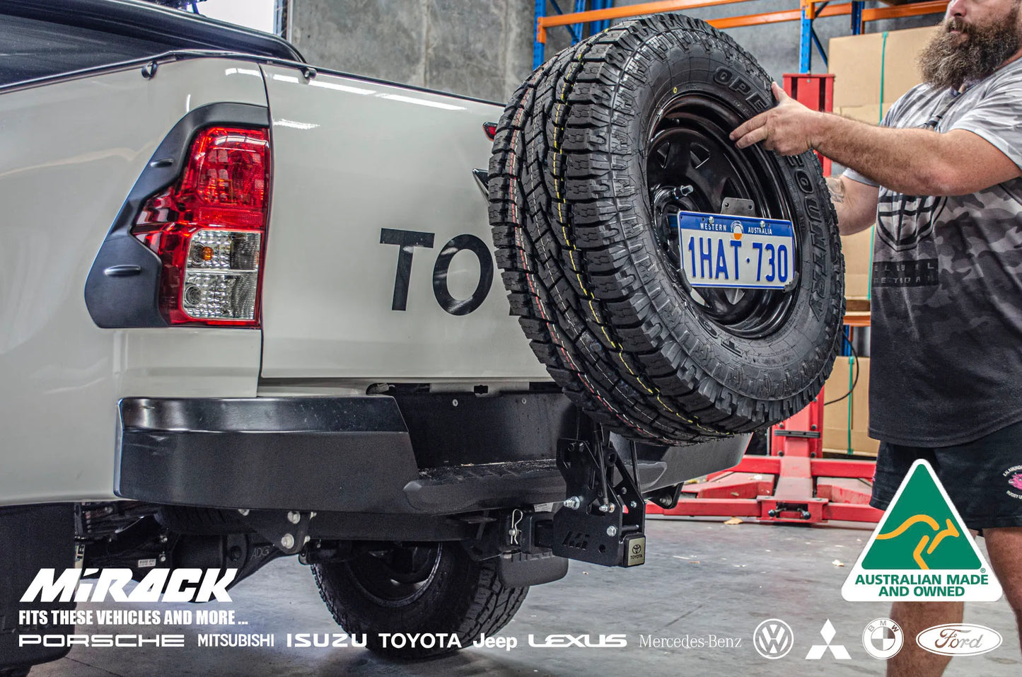 Toyota Hilux SR5 aftermarket upgrade: Mirack's innovative tilting spare wheel carrier for enhanced rear functionality and epic off-road adventures.