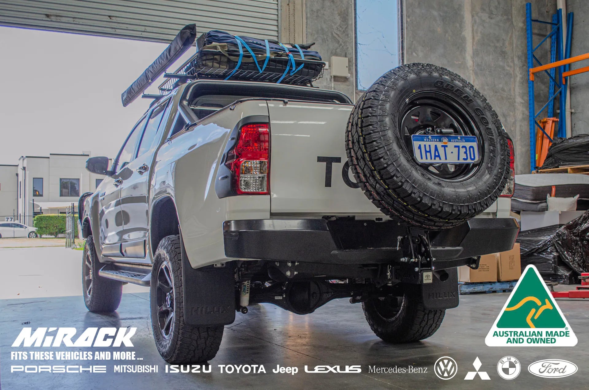 asy rear access & off-road freedom: Toyota Hilux SR5 upgraded with Mirack's tilting spare wheel carrier.